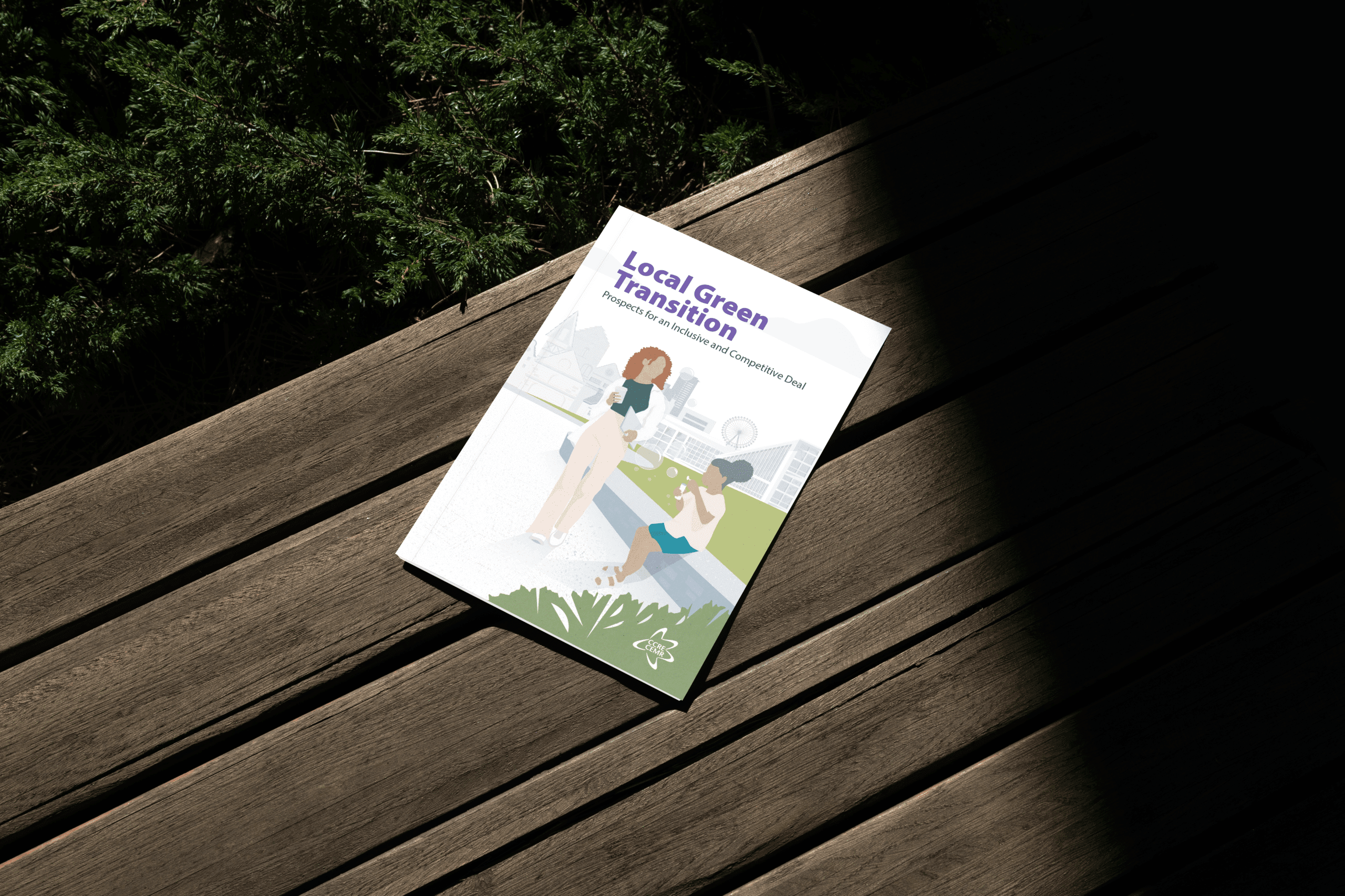 The printed Local Green Transition report, subtitled “Prospects for an Inclusive and Competitive Deal”, lying on a wooden deck